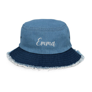 Denim bucket hat with a distressed brim, personalized with custom name embroidery.
